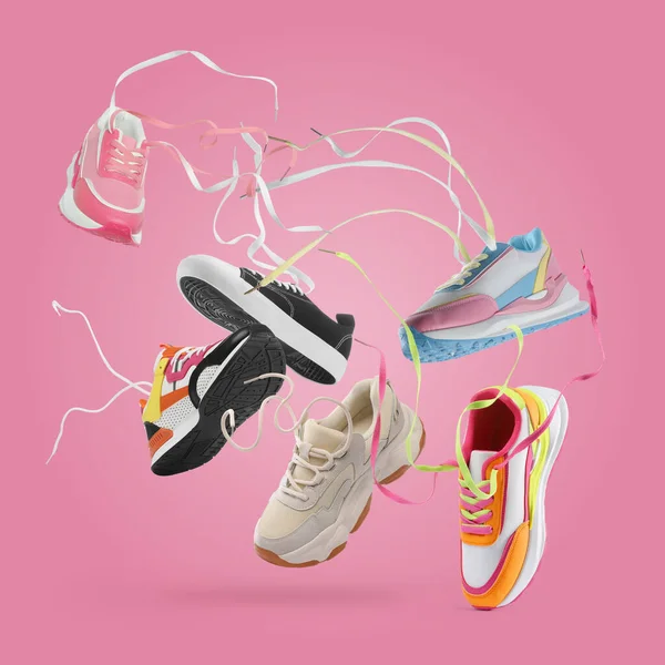 Olika Snygga Sneakers Luften Rosa Bakgrund Collage Design — Stockfoto