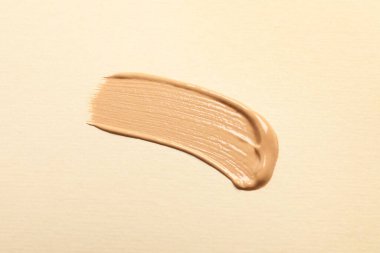 Bej arka plan, üst görünüm cilt temeli lekesi