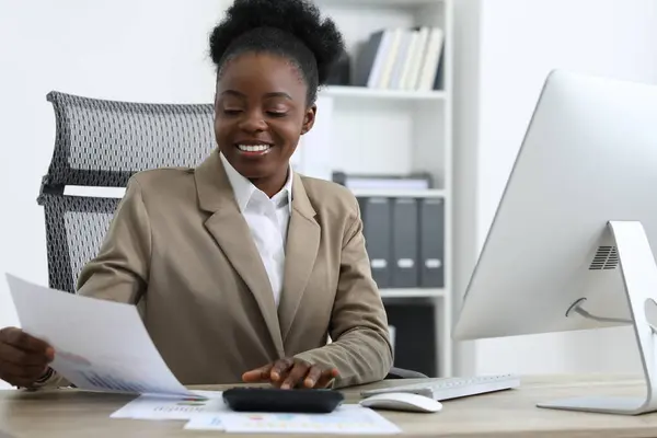 stock image Professional accountant working at wooden desk in office