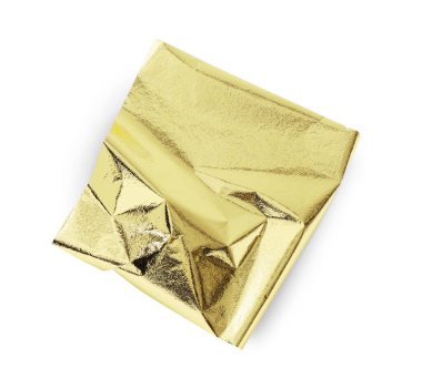 Bir adet yenilebilir altın yaprak, beyaza izole edilmiş, üst manzara