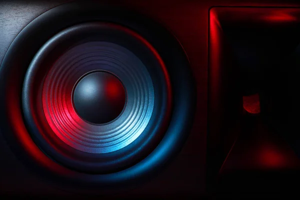 One sound speaker in neon light as background, closeup