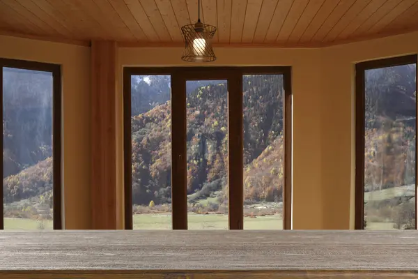 Empty wooden table against window indoors. Space for design
