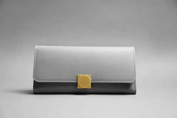 Stylish leather purse on light grey background