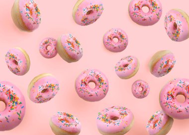 Pembe arka plana serpiştirilmiş lezzetli çörekler.