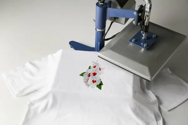 Custom t-shirt. Using heat press to print image of beautiful hibiscus flowers
