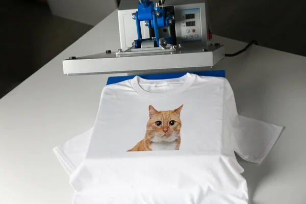 Custom t-shirt. Using heat press to print photo of cute ginger cat