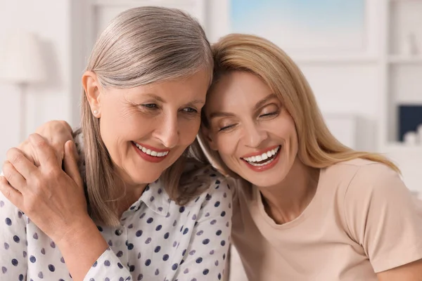 stock image Happy mature mother and her daughter at home