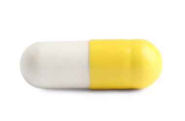 Beyaz arka planda bir hap. Tıbbi tedavi