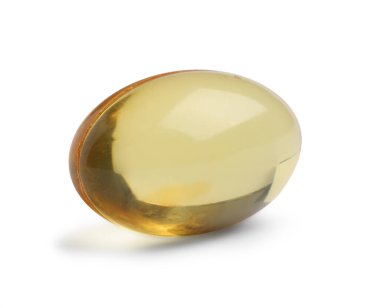 Beyaz arka planda sarı bir hap. Tıbbi tedavi