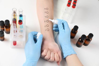 Doctor doing skin allergy test at light table, above view clipart