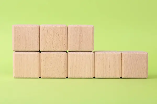 International Organization for Standardization. Wooden cubes with abbreviation ISO and number 18001 on light green background