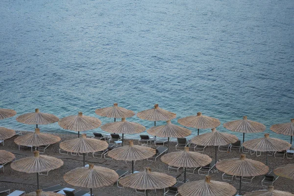 Many beach umbrellas near sea at resort