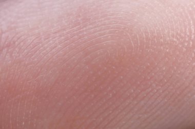 Arka plan olarak parmak üzerinde sürtünme çıkıntıları, makro görünüm