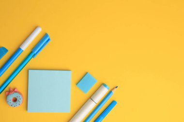 Flat lay composition with different school stationery on yellow background, space for text. Back to school