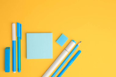 Flat lay composition with different school stationery on yellow background, space for text. Back to school