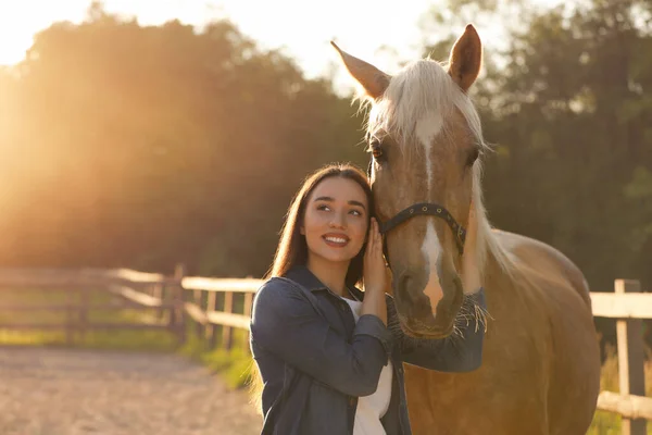 stock image Beautiful woman with adorable horse outdoors, space for text. Lovely domesticated pet