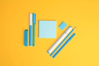 Flat lay composition with different school stationery on yellow background, space for text. Back to school