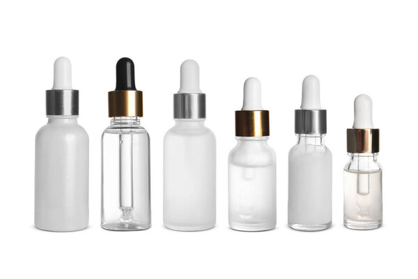 Serums in different bottles isolated on white, collection
