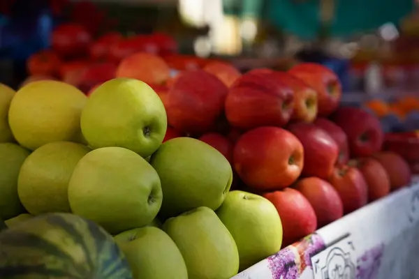 Different fresh ripe fruits on counter at market, closeup