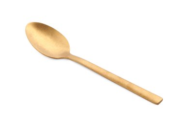 Yeni bir altın kaşık beyaz üzerine izole edilmiş