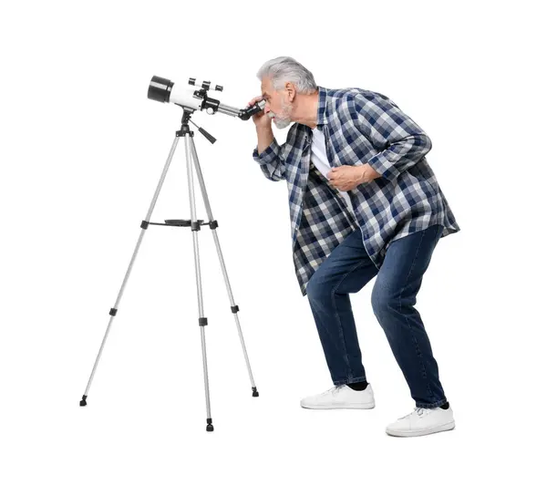 stock image Senior astronomer looking at stars through telescope on white background