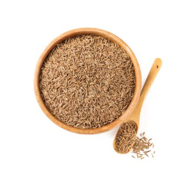 Beyaz, üst görünüm izole tohumlar (İran kimyon) kase ve kaşık aromatik oyma