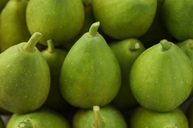 Many fresh green figs as background, closeup