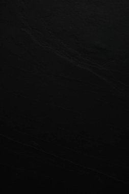 Arkaplan olarak siyah taş yüzeyinin dokusu, yakın plan