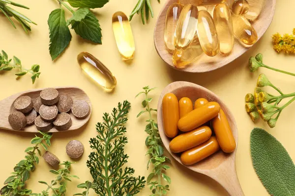 Different Pills Herbs Pale Orange Background Flat Lay Dietary Supplements — Stock Photo, Image