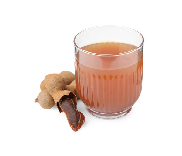 Glass of tamarind juice and fresh fruits isolated on white