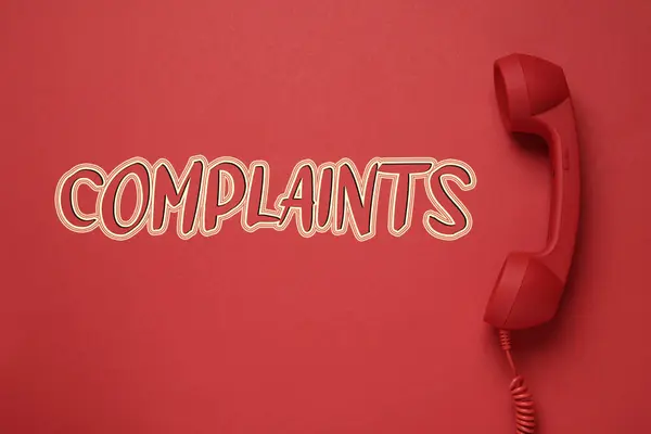 Corded Telephone Handset Word Complaints Red Background Top View — Stock Photo, Image