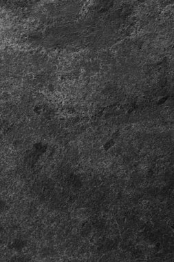 Arkaplan olarak koyu gri taş yüzeyin dokusu, yakın plan