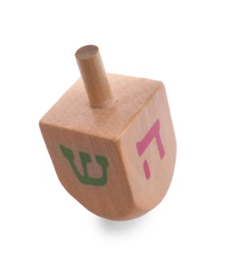 Wooden dreidel isolated on white. Traditional Hanukkah game clipart