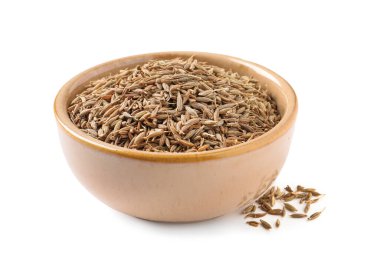 Bowl of aromatic caraway (Persian cumin) seeds isolated on white clipart