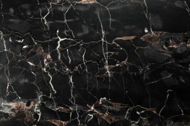 Arkaplan olarak siyah mermer taş yüzeyinin dokusu, yakın plan