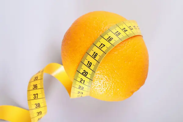 Cellulite Problem Orange Measuring Tape Light Grey Background Top View Royalty Free Stock Photos