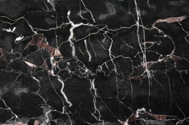 Arkaplan olarak siyah mermer taş yüzeyinin dokusu, yakın plan