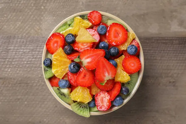 Delicious Fresh Fruit Salad Bowl Wooden Table Top View — Stock Photo, Image