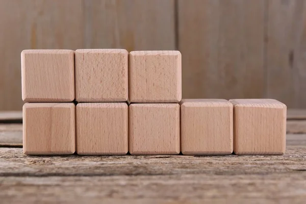 International Organization for Standardization. Cubes with abbreviation ISO 22000 on wooden table