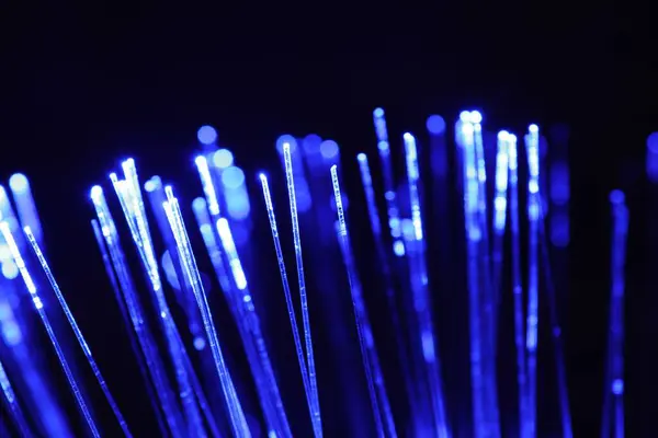 Optical Fiber Strands Transmitting Blue Light Black Background Closeup — Stock Photo, Image