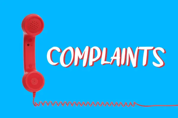 Corded Telephone Handset Word Complaints Light Blue Background — Stock Photo, Image
