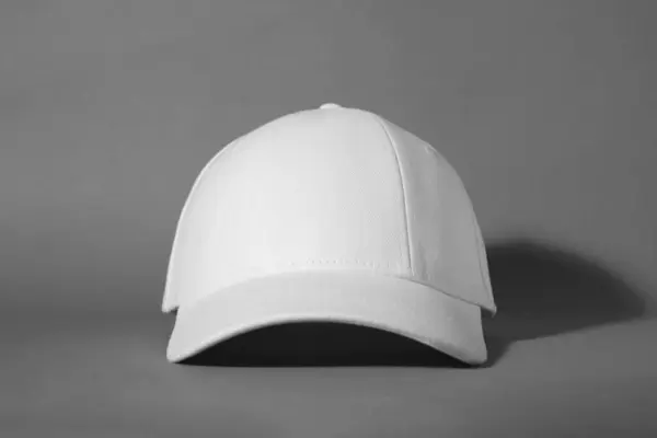 stock image Stylish white baseball cap on grey background