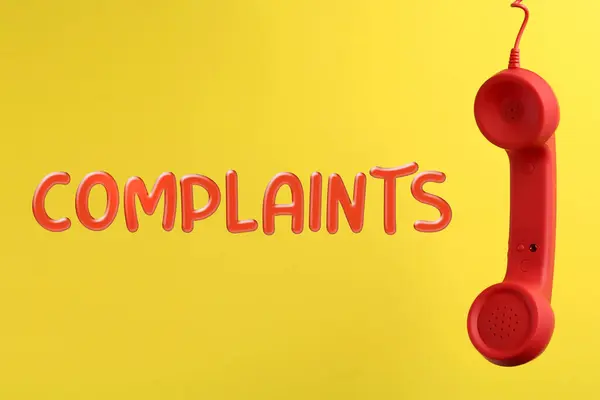 Corded Telephone Handset Word Complaints Yellow Background — Stock Photo, Image