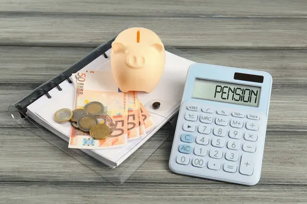 Calculator Piggy Bank Euro Banknotes Coins Folder Wooden Table Pension — Stock Photo, Image