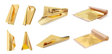 Beyaza izole edilmiş yenilebilir altın yapraklar.