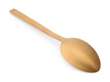Yeni bir altın kaşık beyaz üzerine izole edilmiş
