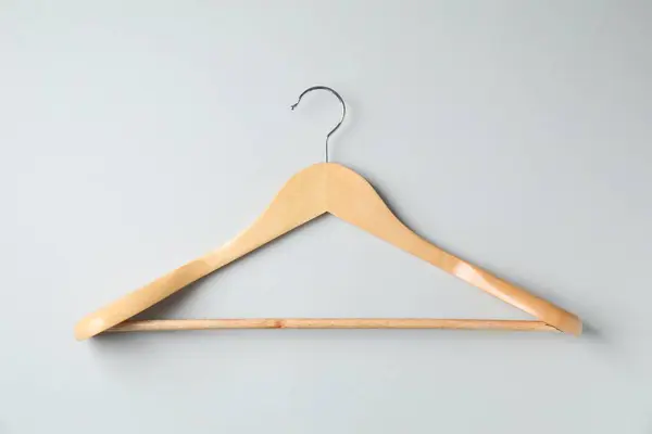 Empty Wooden Hanger Light Grey Background Top View — Stockfoto