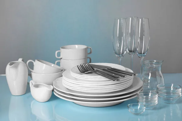 Set Clean Dishes Glasses Cutlery Light Blue Table — Stock Photo, Image