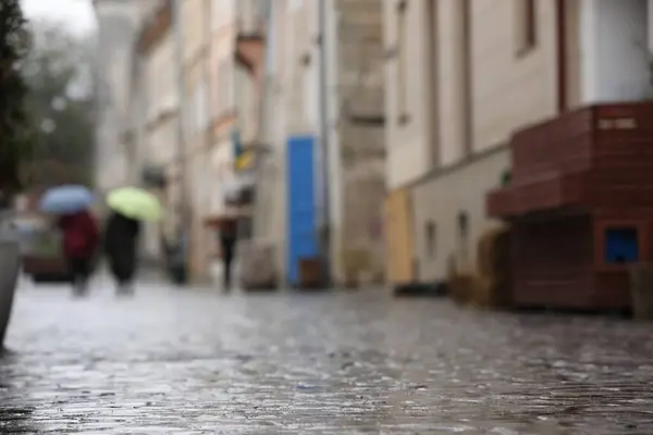 Wet pavement on city street after rain