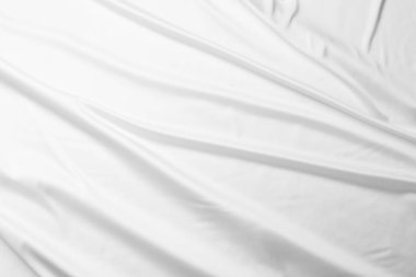 Arka plan olarak beyaz ipek dalgalı kumaş dokusu, üst görünüm